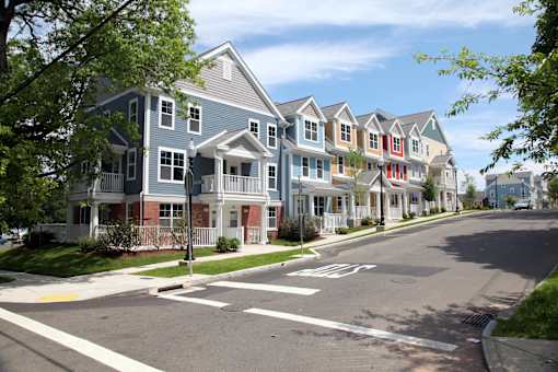 a row of town houses on the corner of a street