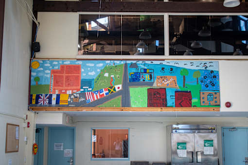 a mural on the wall of a classroom in a school