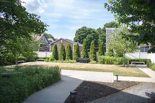 A park with a bench and a pathway.