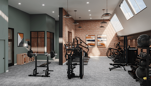 A gym with a variety of equipment including weights and a bench.