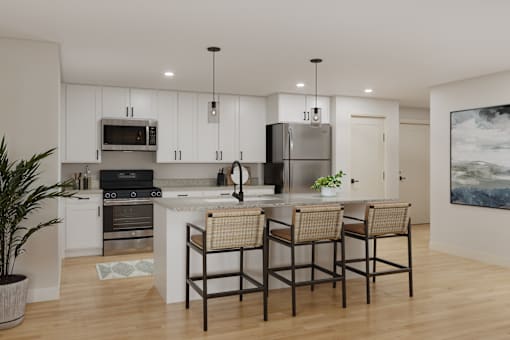 A modern kitchen with a large island and four chairs.