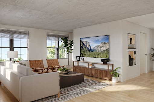 A living room with a large painting on the wall and a couch.