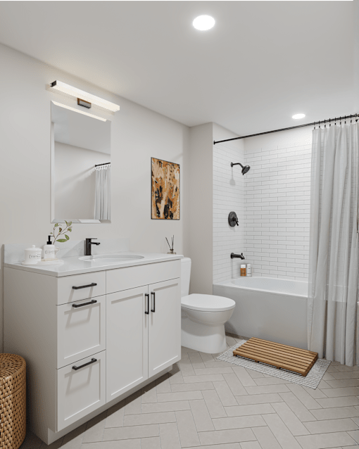 A white bathroom with a sink, toilet, and bathtub.