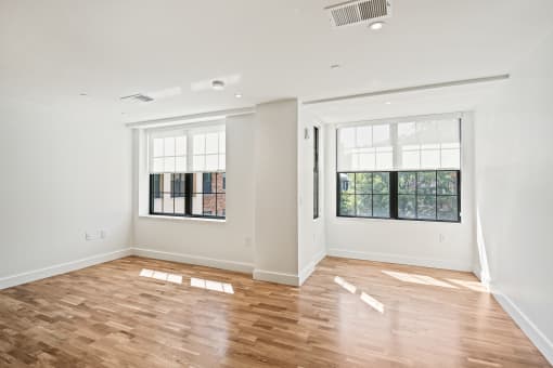 living room with white walls and wood floors