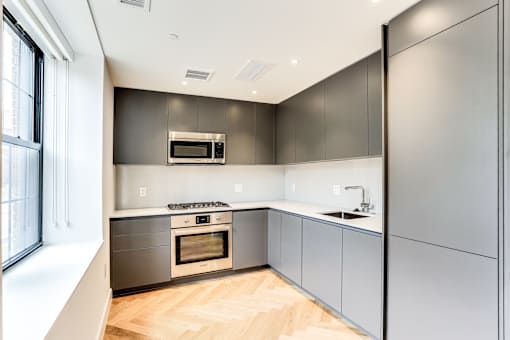 Studi apartment kitchen with European finished and hardwood floors