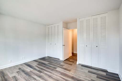 bedroom with two closets
