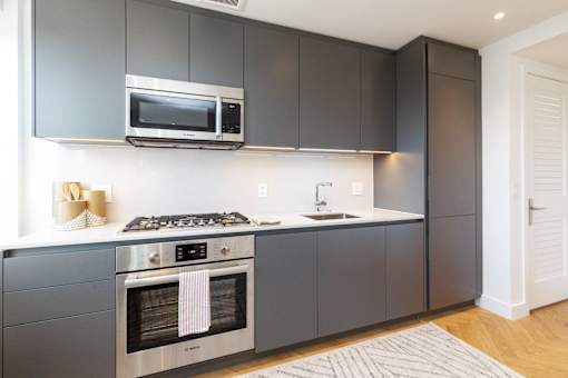 The Stanton studio apartment kitchen with quartz countertops