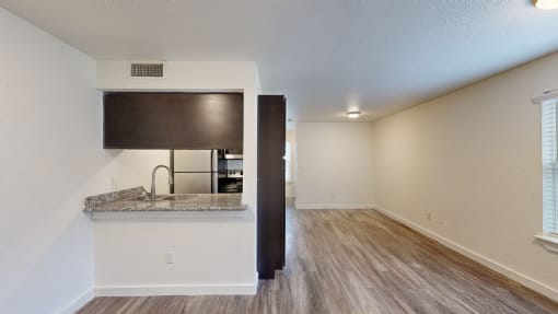a kitchen and dining area in a 555 waverly unit at Bennett Ridge Apartments, Oklahoma City
