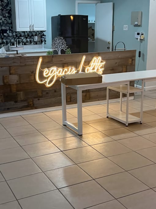 a neon sign sitting on a table in a restaurant