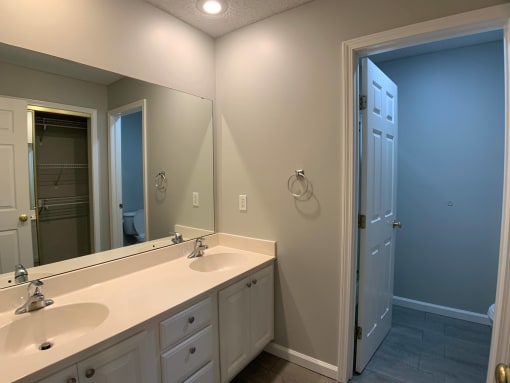 Large bathroom with double vanity and separate shower room