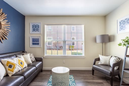 Living room with large window at Bennett Ridge Apartments, Oklahoma City, 73132