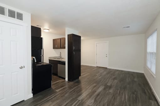 a kitchen and living room in a 555 waverly unit at Bennett Ridge Apartments, Oklahoma, 73132