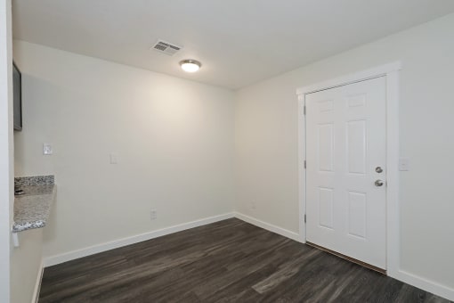 a bedroom with hardwood flooring and white walls at Bennett Ridge Apartments, Oklahoma City, OK, 73132