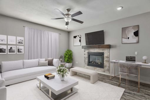 a living room with a white couch and a fireplace