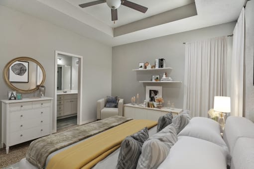 a bedroom with a bed and a ceiling fan