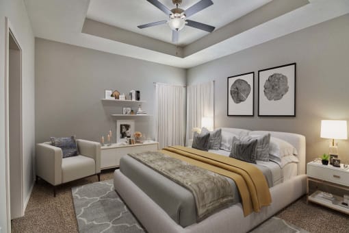 a bedroom with a bed and a ceiling fan