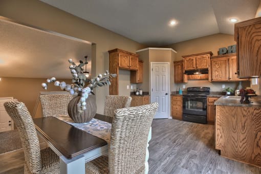 a dining room with a table and chairs
