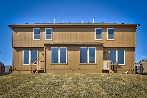 a new house with a yard in front of it