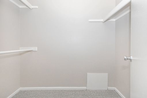A white door is on the right side of a room.