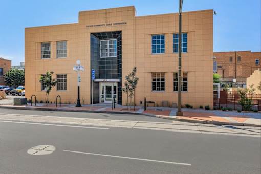 A building with a sign that says "TEXAS EMBASSY CARIBBEAN CORPORATION" on it.