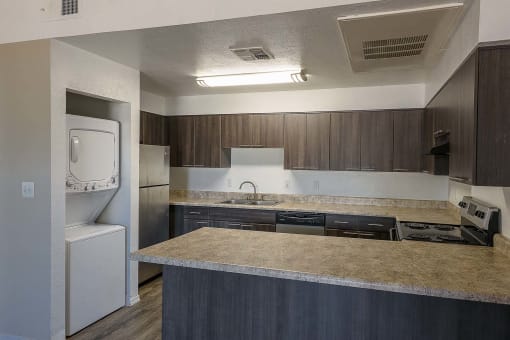 a kitchen with a counter top and a sink
