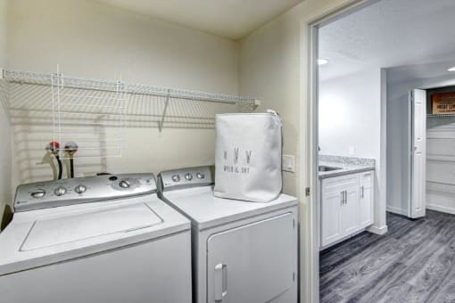 12 Central Square Laundry Room with Washer and Dryer and Laundry Basket