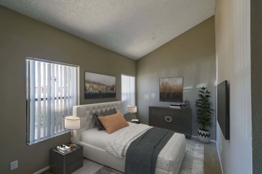 a bedroom with a large window and a bed