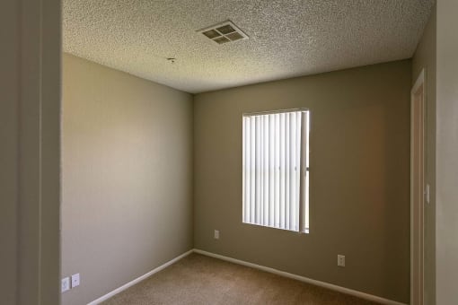 an empty room with a window in it