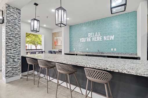 A bar area with a sign that says "Relax you're here now".