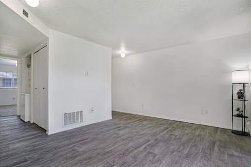 A room with a grey floor and white walls.