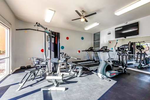 A well-equipped gym with a variety of exercise machines.