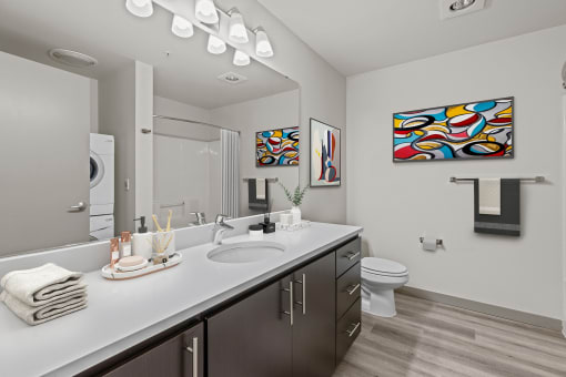 a bathroom with a sink and a toilet and a mirror