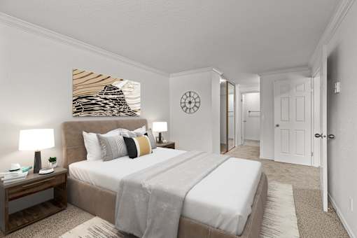 A bedroom with a large bed and a painting on the wall.
