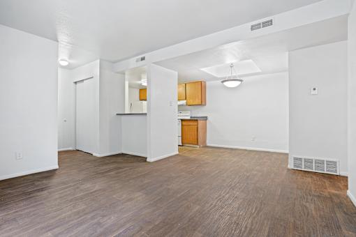 A room with wooden floors and white walls.