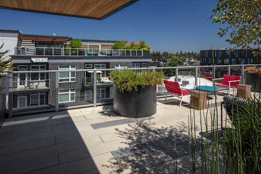 A patio area with a table and chairs is shown.
