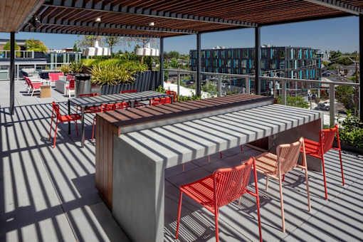 A patio with a table and chairs.