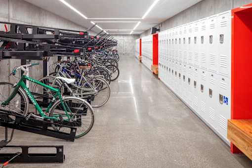A bike rack with bikes on it in a hallway.