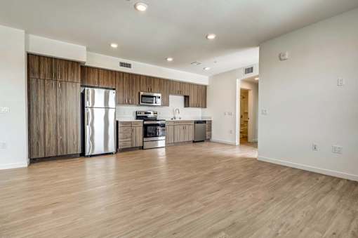 A kitchen with wooden cabinets and stainless steel appliances.