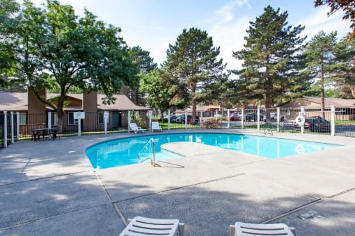 Arbropointe Apartments Pool with Lounge Chairs