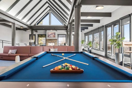 a pool table in the living room of a house