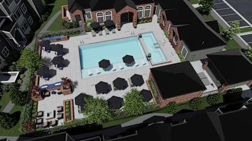 an aerial view of a swimming pool with black umbrellas and a brick building in the