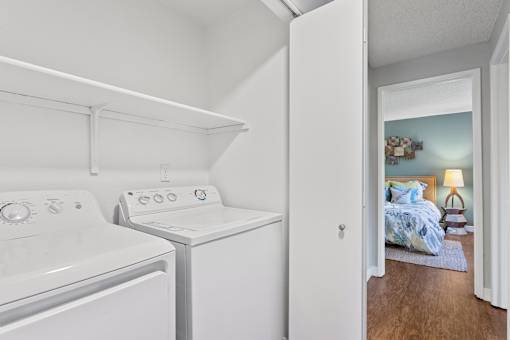 In-unit laundry with washer and dryer at Cedar Crest Apartments in West Beaverton, Oregon.