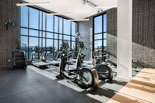 A gym with treadmills and exercise bikes.