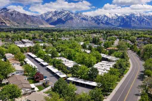 A suburban area with houses and a mountain range in the background.