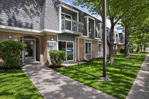 A house numbered 803 with a green lawn in front.