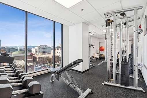 A gym with a view of the city.