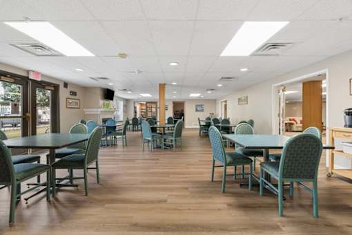 A room with tables and chairs.