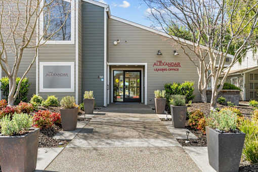 The front of a building with the name Alexandre Leasing Office on it.