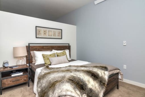 a bedroom with a bed and a nightstand