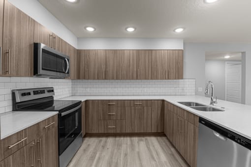 the preserve at ballantyne commons apartment kitchen with stainless steel appliances
